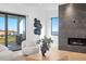 Bright living room with fireplace, modern decor, and sliding doors to the water view at 2081 Michigan Ne Ave, St Petersburg, FL 33703