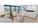Bright living room with hardwood floors, stylish furniture, and expansive views of the water at 2081 Michigan Ne Ave, St Petersburg, FL 33703