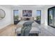 Beautifully staged main bedroom features contemporary decor and view-framing windows at 2081 Michigan Ne Ave, St Petersburg, FL 33703