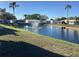 Community pond with a fountain and landscaping at 215 S Port Royal Ln, Apollo Beach, FL 33572