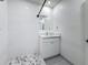 Modern bathroom features tiled shower, stylish vanity with ample storage, and neutral color palette at 2427 10Th S Ave, St Petersburg, FL 33712