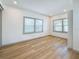 Bright bedroom featuring light wood floors and two large windows that let in natural light at 2427 10Th S Ave, St Petersburg, FL 33712