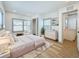 Bright bedroom with ample natural light, a walk-in closet, and a view into the en-suite bathroom at 2427 10Th S Ave, St Petersburg, FL 33712