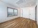 A bedroom with two windows, light-colored wood floors, and neutral wall color at 2427 10Th S Ave, St Petersburg, FL 33712