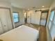 Well-lit bedroom includes a laundry closet, large window and modern minimalist design at 2427 10Th S Ave, St Petersburg, FL 33712