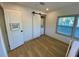 Bright bedroom showcases modern design with a functional washer/dryer closet and ample natural light at 2427 10Th S Ave, St Petersburg, FL 33712
