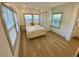 Sun-filled bedroom features hardwood floors, white trim, and serene ambiance for relaxed living at 2427 10Th S Ave, St Petersburg, FL 33712