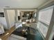 Sunlit dining area showcasing an open floor plan that flows into a modern kitchen and cozy living room at 2427 10Th S Ave, St Petersburg, FL 33712