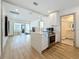 A modern open-concept kitchen features new stainless steel appliances and an island with bar seating at 2427 10Th S Ave, St Petersburg, FL 33712