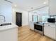 Bright kitchen features sleek quartz countertops, stainless steel appliances, and updated cabinets at 2427 10Th S Ave, St Petersburg, FL 33712