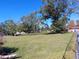 Spacious backyard with mature trees, offering a private and serene setting at 2601 11Th Se Ave, Ruskin, FL 33570