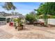 Backyard featuring an outdoor patio, bar area, and lush green landscaping at 263 42Nd Ne Ave, St Petersburg, FL 33703