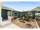 Private backyard oasis with a rock garden, plants, and patio at 263 42Nd Ne Ave, St Petersburg, FL 33703