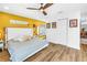 Bedroom featuring hardwood floors, modern decor, and a large window at 263 42Nd Ne Ave, St Petersburg, FL 33703