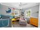 Charming Bedroom with a crib, bookshelf, rocker, and playful nautical theme at 263 42Nd Ne Ave, St Petersburg, FL 33703