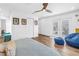 Bright bedroom featuring hardwood floors, modern decor, and french doors to the patio at 263 42Nd Ne Ave, St Petersburg, FL 33703