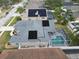 Home with rooftop solar and enclosed pool in a neighborhood setting, beautifully maintained landscaping at 5206 Whispering Leaf Trl, Valrico, FL 33596