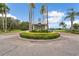 Welcome to Twin Lakes, an inviting community with landscaped entrance, tall palms, and well-maintained shrubbery at 5206 Whispering Leaf Trl, Valrico, FL 33596