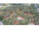 Aerial view of a neighborhood park featuring a playground and mature trees providing ample shade at 5206 Whispering Leaf Trl, Valrico, FL 33596