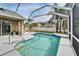 Sparkling screened-in pool area featuring a refreshing blue pool and deck with ample space for seating at 5206 Whispering Leaf Trl, Valrico, FL 33596