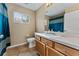 Traditional bathroom featuring blue shower curtain and tile flooring at 5809 War Admiral Dr, Wesley Chapel, FL 33544