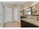 An updated bathroom with dual vanity, granite counters and walk in shower at 5809 War Admiral Dr, Wesley Chapel, FL 33544