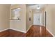 Cozy dining room area featuring hardwood floors and a breakfast bar overlooking the kitchen at 5809 War Admiral Dr, Wesley Chapel, FL 33544