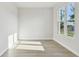 Bright, empty bedroom with a big window providing natural light and neutral paint at 687 Allora Ave, Nokomis, FL 34275