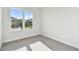 Bright bedroom with large window offering natural light and a pleasant view of the outdoors at 687 Allora Ave, Nokomis, FL 34275