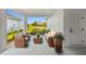 Relaxing outdoor patio featuring comfortable seating and views of the landscaped yard at 687 Allora Ave, Nokomis, FL 34275