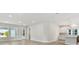 Bright living room with hardwood floors, white walls, and an open layout with recessed lighting at 687 Allora Ave, Nokomis, FL 34275