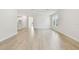 Bright living room with hardwood floors, recessed lighting, and a view to the kitchen at 687 Allora Ave, Nokomis, FL 34275