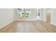 Bright living room with hardwood floors, and a view to the exterior at 687 Allora Ave, Nokomis, FL 34275