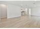 Bright living room with hardwood floors, recessed lighting, and a view to the kitchen at 687 Allora Ave, Nokomis, FL 34275