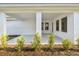 Covered patio with a manicured yard and clean exterior design at 687 Allora Ave, Nokomis, FL 34275