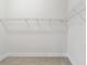 Well-organized walk-in closet with modern metal shelving for clothing and accessories at 687 Allora Ave, Nokomis, FL 34275