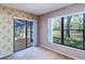 Spacious bedroom with large windows and a view of the outdoors at 3505 Tarpon Woods Blvd # K406, Palm Harbor, FL 34685