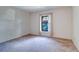 This bedroom features carpet and a window with neutral-toned curtains for natural light at 3505 Tarpon Woods Blvd # K406, Palm Harbor, FL 34685