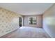 Spacious bedroom with large windows and a view of the outdoors at 3505 Tarpon Woods Blvd # K406, Palm Harbor, FL 34685