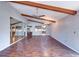 Spacious living room featuring hardwood floors, vaulted ceilings, wood beams, and a large mirror wall at 3505 Tarpon Woods Blvd # K406, Palm Harbor, FL 34685