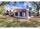 This home boasts a charming sunroom, offering a tranquil retreat with views of the lush yard at 3505 Tarpon Woods Blvd # K406, Palm Harbor, FL 34685