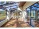 Sunroom offers ample natural light, with multiple windows overlooking the backyard, and a tile floor at 3505 Tarpon Woods Blvd # K406, Palm Harbor, FL 34685