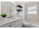 Elegant bathroom with marble accents, a soaking tub, and a modern vanity, providing a luxurious and relaxing environment at 10079 83Rd Way, Seminole, FL 33777