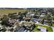 An aerial view of a neighborhood showcasing well-maintained homes, lush greenery, and streetscapes at 1309 Nokomis S Ave, Venice, FL 34285
