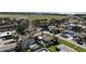Scenic aerial view of a residential neighborhood showcasing mature trees, swimming pools, and manicured lawns at 1309 Nokomis S Ave, Venice, FL 34285