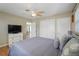 Bright bedroom with ceiling fan, ensuite bathroom and a calming color scheme at 1309 Nokomis S Ave, Venice, FL 34285