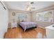 Serene bedroom with hardwood floors, lots of natural light, and a comfortable bed at 1309 Nokomis S Ave, Venice, FL 34285