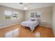 Bright bedroom with hardwood floors, lots of natural light, and a comfortable bed at 1309 Nokomis S Ave, Venice, FL 34285