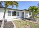 Charming home with freshly painted exterior, large window and meticulous landscaping at 1309 Nokomis S Ave, Venice, FL 34285