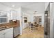 Bright kitchen featuring granite countertops and stainless steel dishwasher at 1309 Nokomis S Ave, Venice, FL 34285